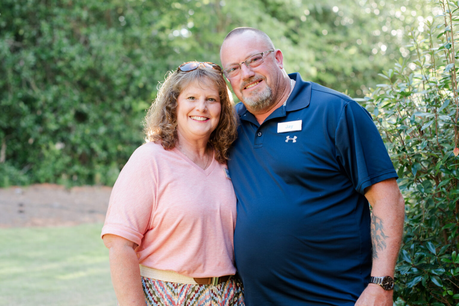 Couple smiling together during respite retreat for caregiver wellness.