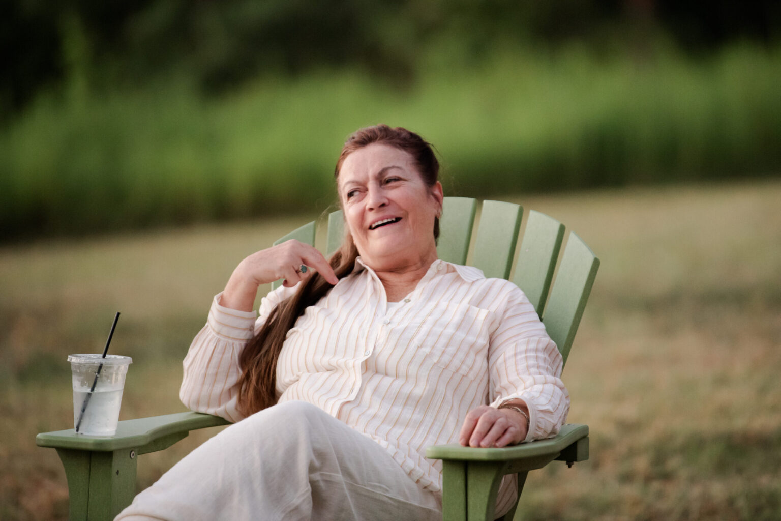 Caregiver laughing during a wellness retreat focused on mental health.